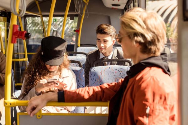 Group Of Young People Riding In Public Transport.jpg