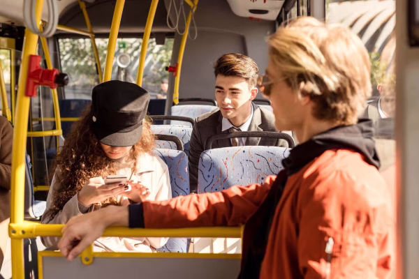 Group Of Young People Riding In Public Transport.jpg